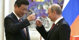 الرئيس الروسي فلاديمير بوتين (يمين الصورة) والصيني يسارًا.jpg