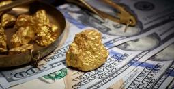 الدولار والذهب.jpg