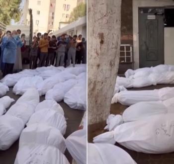الطواقم الطبية تصلي على الشهداء قبر دفنهم بقبر جماعي
