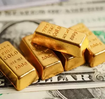 الدولار والذهب.webp