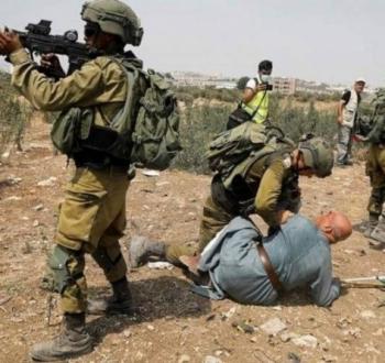 اعتداء سابق على مسن فلسطيني.jpg