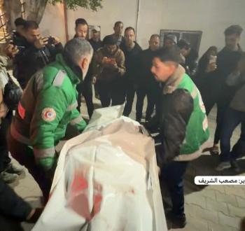 نقل شهداء من مجزرة مدرسة في حي التفاح1.jpg