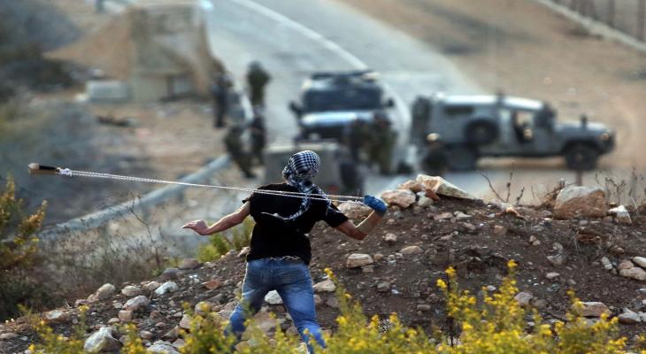 شاب فلسطيني خلال مواجهات في الضفة.jpg