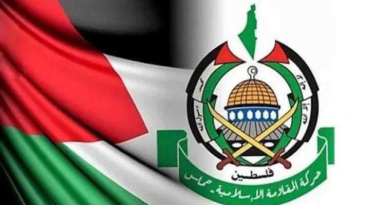 حماس.. الشعار وعلم فلسطين.jpg