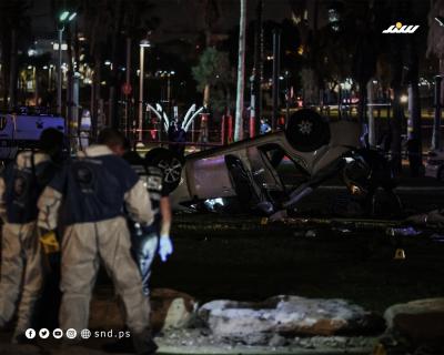 شرطة الاحتلال تتفقد موقع عملية تل أبيب (4).jpg